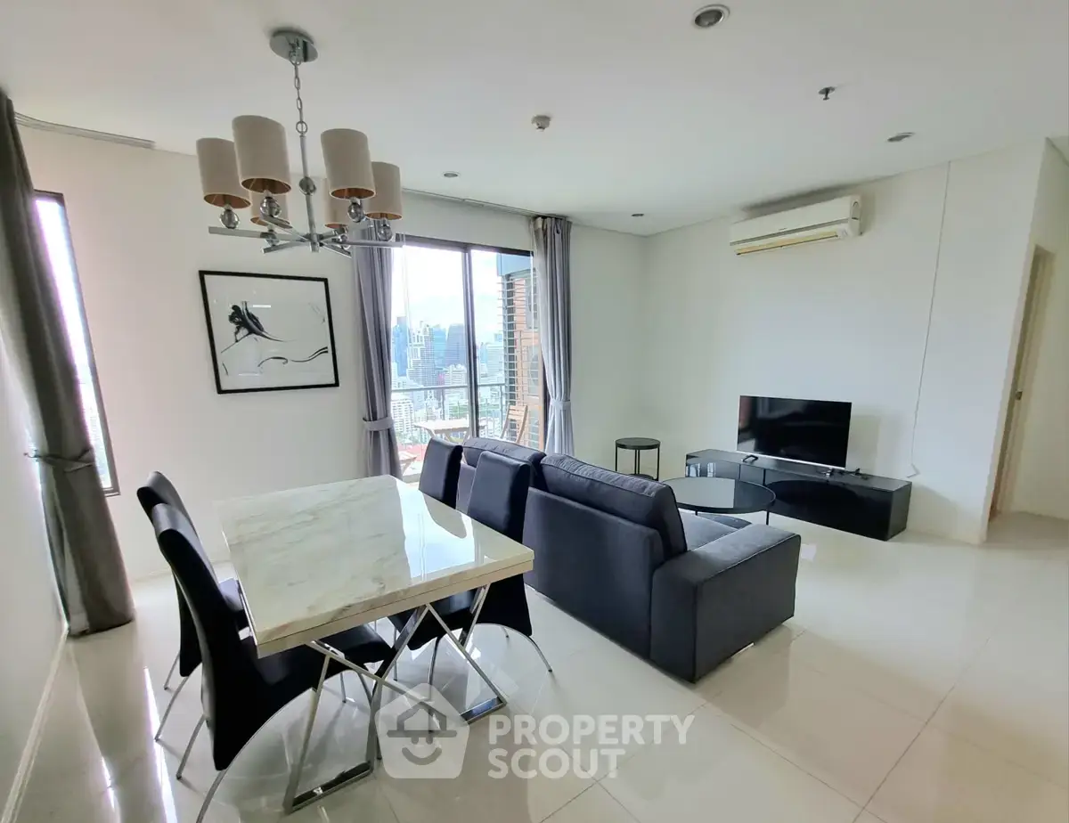 Spacious modern living room with city view, elegant dining area, and sleek furnishings.
