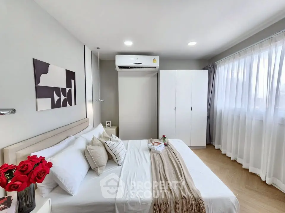 Bright and cozy bedroom with modern decor and natural light