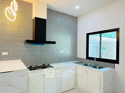 Modern kitchen with gas stove and sleek design