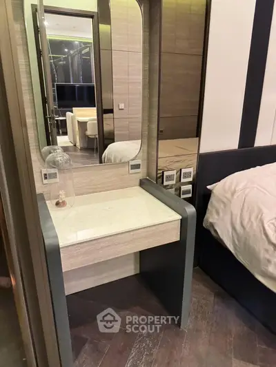 Modern bedroom with stylish vanity and elegant decor