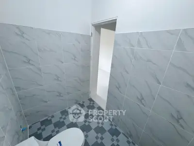 Modern bathroom with elegant gray tiles and sleek design