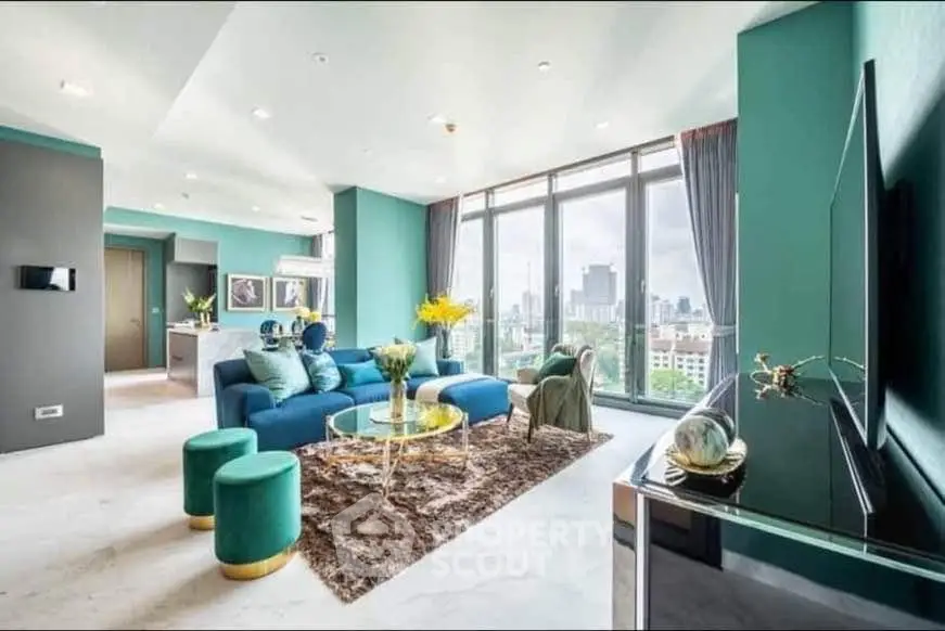Luxurious modern living room with panoramic city view, elegant decor, and spacious layout.
