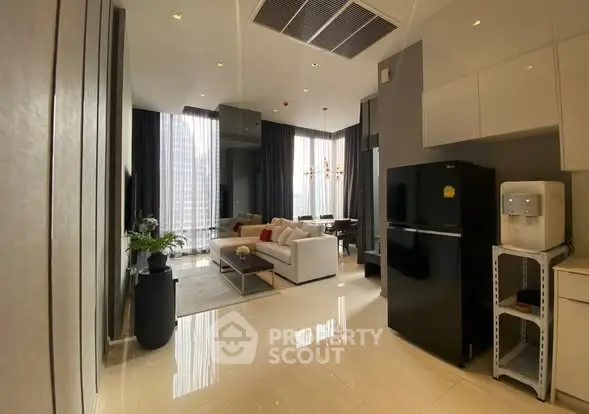 Luxurious modern living room with high ceilings and elegant decor in a city apartment.