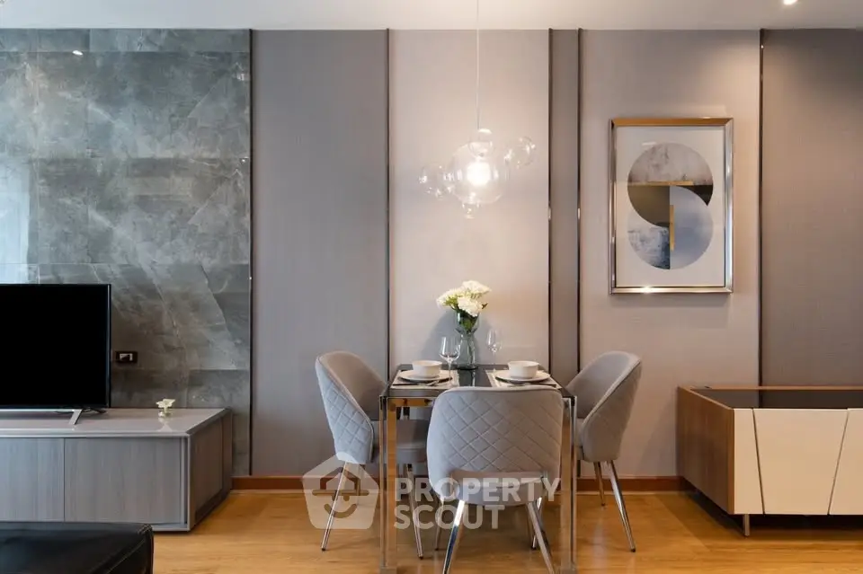 Modern dining area with elegant decor and stylish lighting in a contemporary apartment.