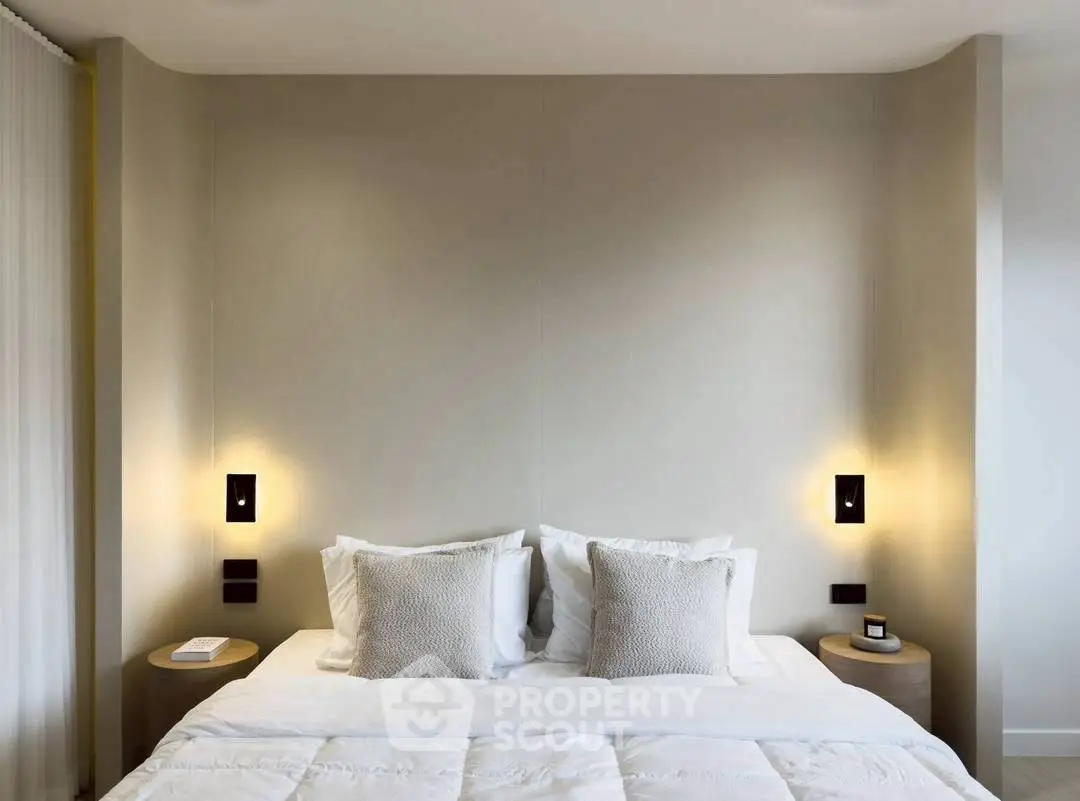 Elegant modern bedroom with cozy lighting and minimalist design.