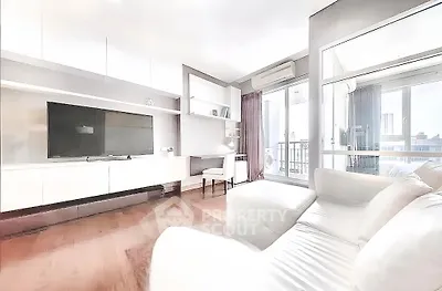 Modern living room with sleek furniture and balcony view