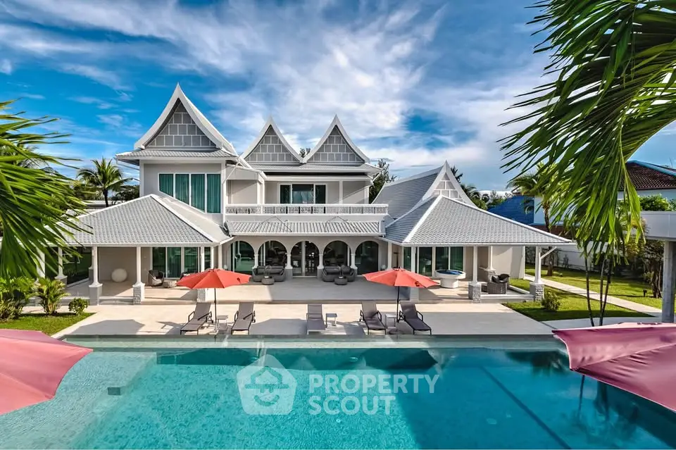 Luxurious tropical villa with stunning pool and unique architectural design.
