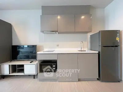 Modern compact kitchen with sleek cabinetry, integrated appliances, and stylish design perfect for urban living.
