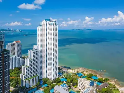 Stunning high-rise building with ocean view in a vibrant coastal cityscape.