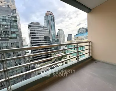 Spacious balcony with stunning cityscape view in modern urban setting.