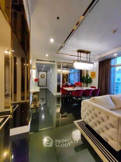 Luxurious living room with elegant dining area and chandelier in modern apartment