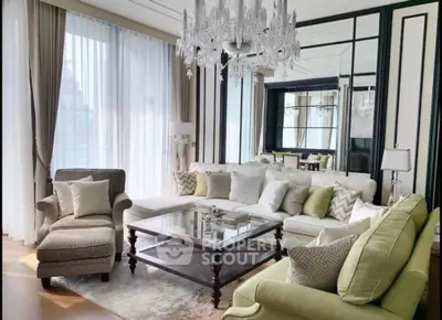 Luxurious living room with elegant chandelier and plush seating in modern apartment