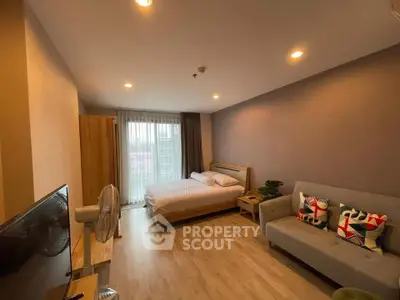 Spacious studio apartment with modern decor and natural light