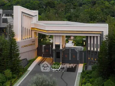 Luxurious modern building entrance with elegant design and lush greenery
