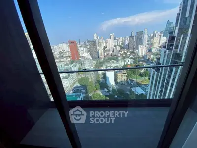 Stunning cityscape view from a modern high-rise balcony, perfect for urban living.
