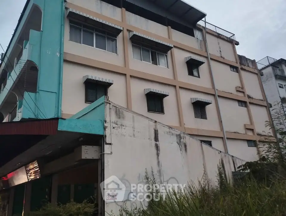 Explore this multi-story building with potential for commercial or residential use, featuring a unique architectural design.