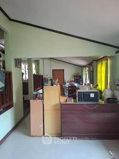 Spacious open-layout living area with modern appliances and ample natural light.