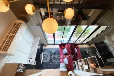 Modern living room with stylish decor and large windows offering a stunning view.