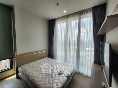 Modern bedroom with large windows and natural light