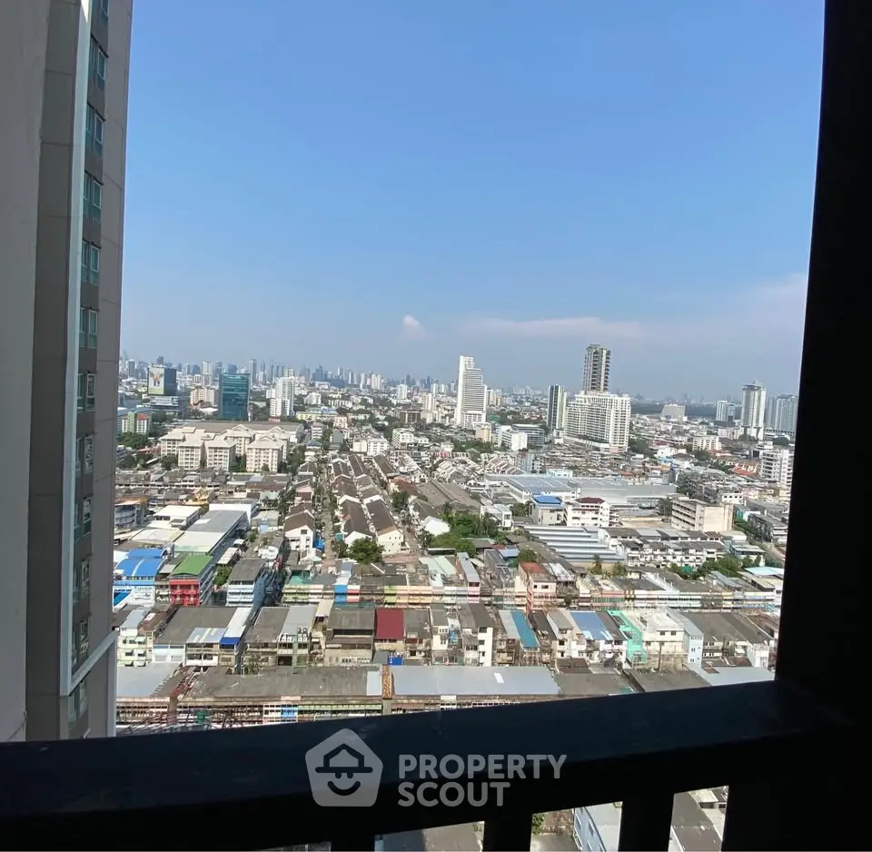 Stunning cityscape view from high-rise balcony showcasing urban skyline and vibrant neighborhood.