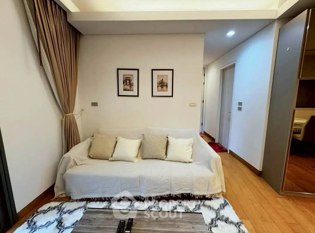 Cozy living room with stylish decor and comfortable seating in modern apartment.