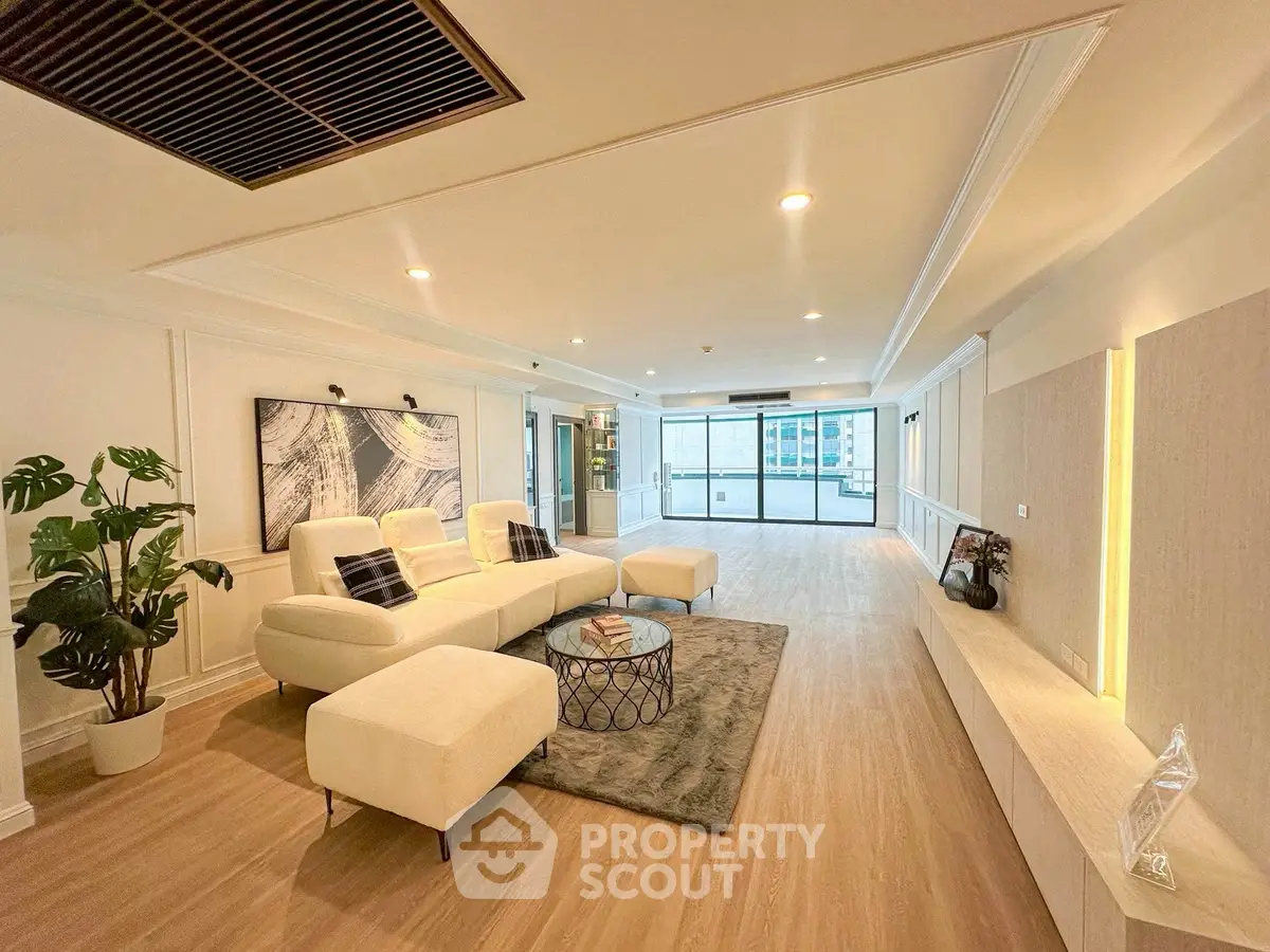 Spacious modern living room with elegant decor and large windows