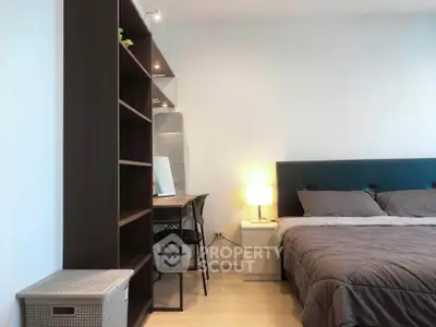 Modern bedroom with cozy bed and stylish study area