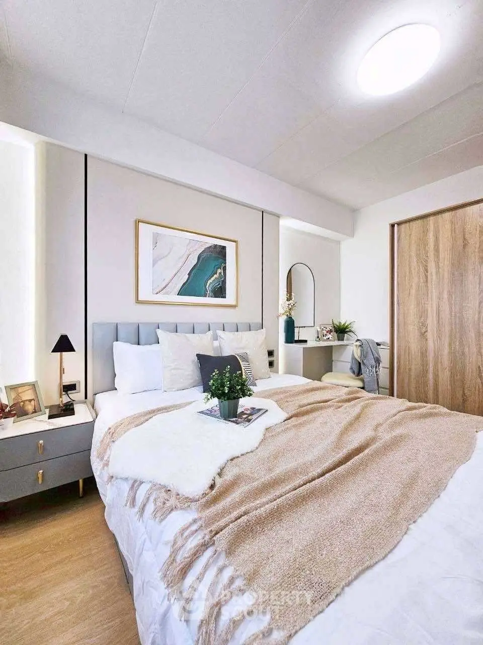 Cozy and modern bedroom with stylish decor and natural light.