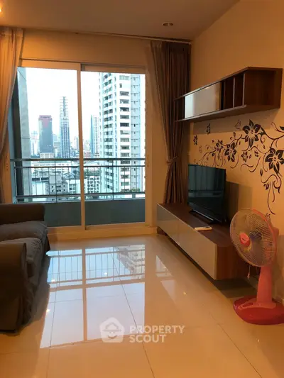 Modern living room with city view, stylish decor, and balcony access in urban apartment.