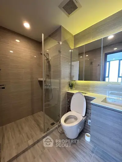 Modern bathroom with glass shower and sleek fixtures