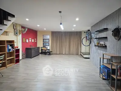 Spacious modern living room with wooden flooring and stylish decor