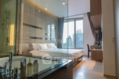 Luxurious modern bedroom with glass-walled bathroom and stunning city view.