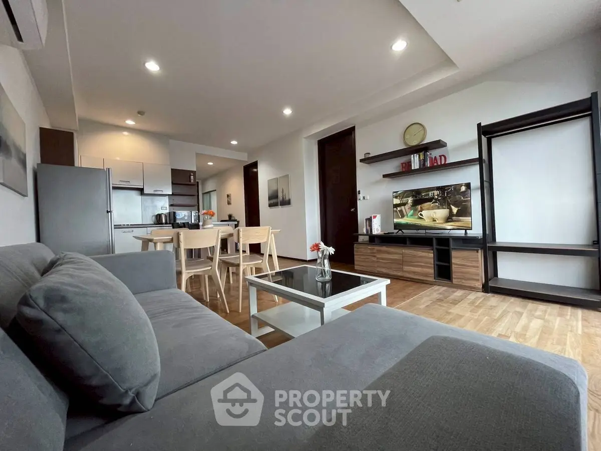 Spacious modern living room with open kitchen and stylish decor