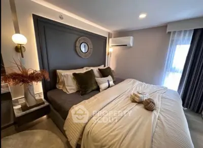 Luxurious bedroom with elegant decor and cozy bedding, featuring modern lighting and stylish accents.