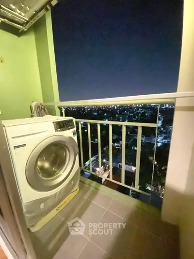 Charming balcony with city view and washing machine, perfect for urban living convenience.