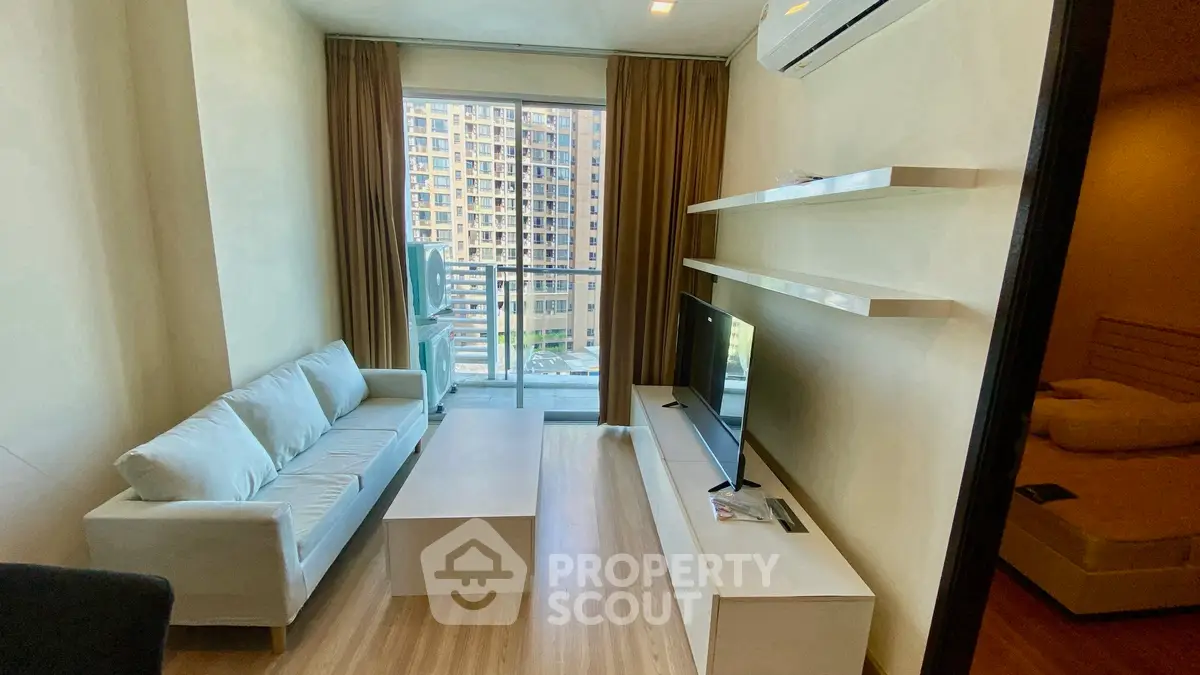 Modern living room with balcony view in urban apartment