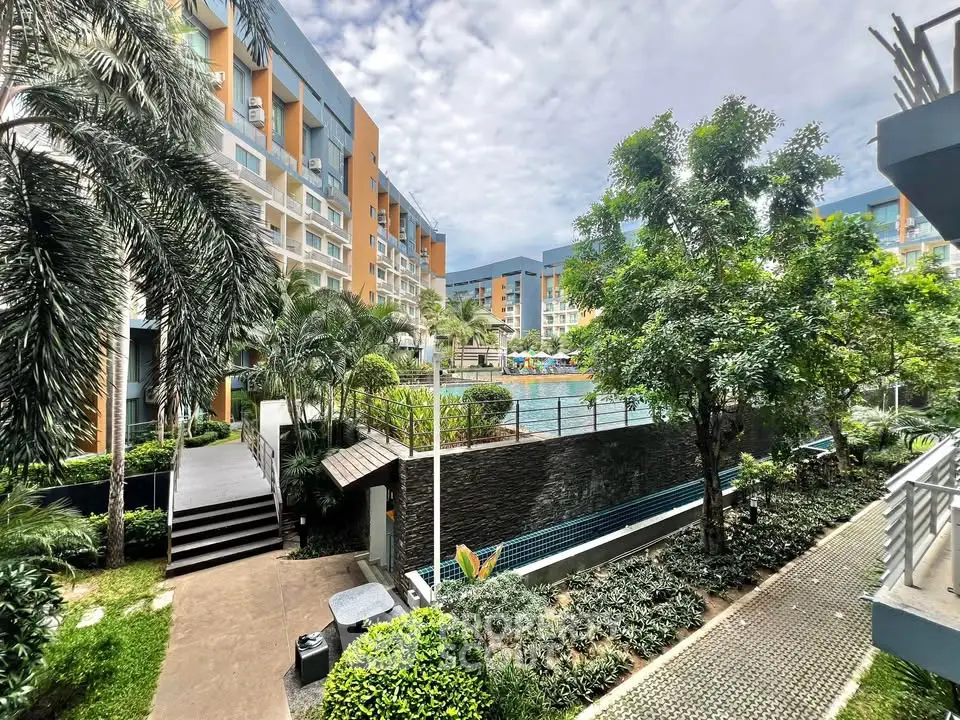 Luxurious residential complex with lush gardens and inviting pool area, perfect for relaxation and leisure.