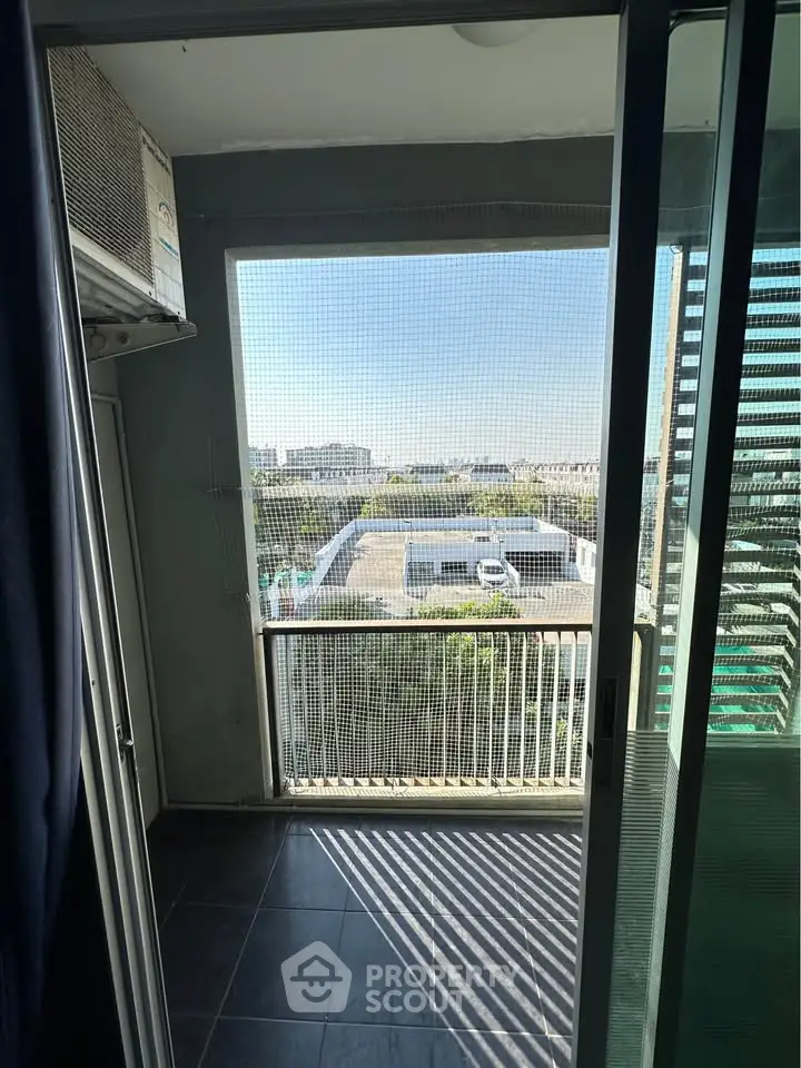 Charming balcony with city view, perfect for relaxation and enjoying the skyline.
