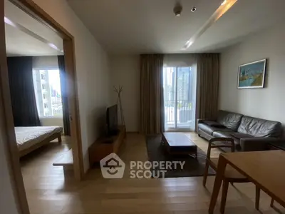 Modern apartment living room with balcony view and stylish furniture