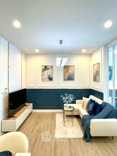 Stylish modern living room with elegant decor and cozy seating area.