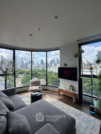 Luxurious living room with panoramic city views and modern decor