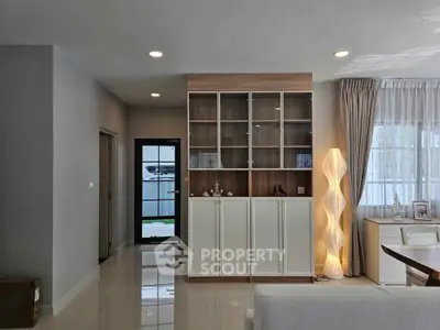 Modern living room with stylish shelving and elegant lighting