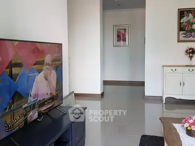 Charming living room with modern TV setup and elegant decor