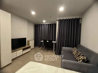 Modern living room with sleek furniture and ambient lighting, perfect for cozy evenings.