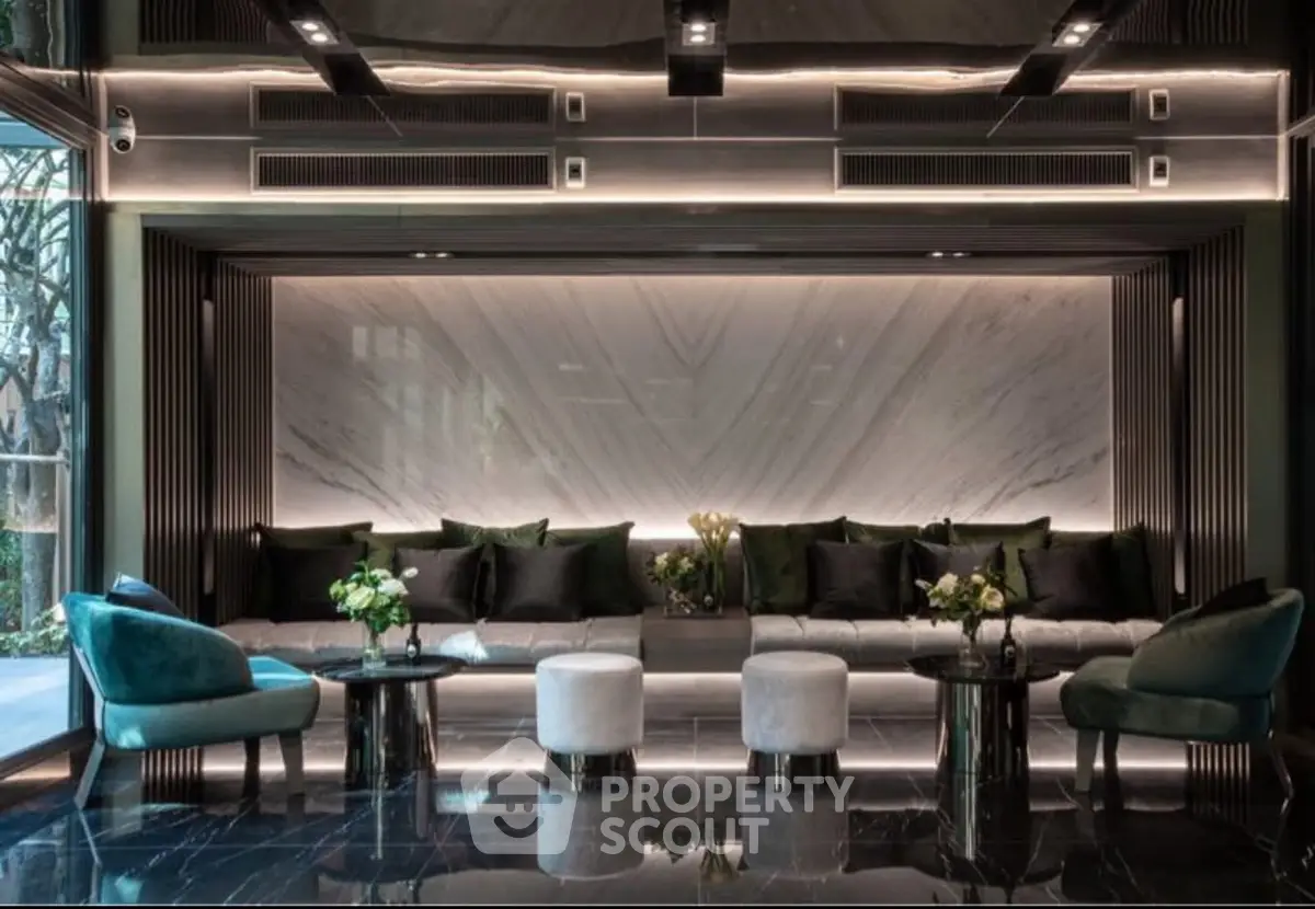 Luxurious modern lobby with elegant seating and marble accents