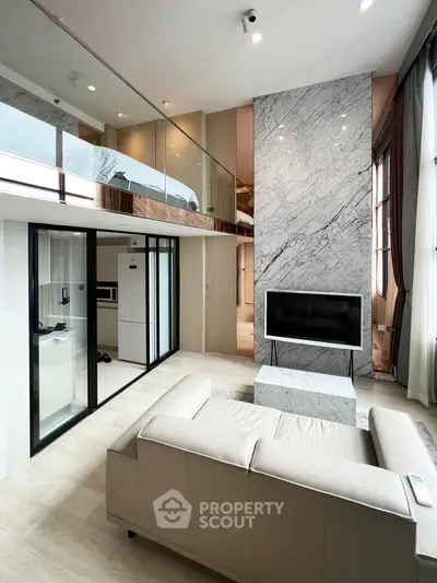 Luxurious modern living room with marble accents and mezzanine level