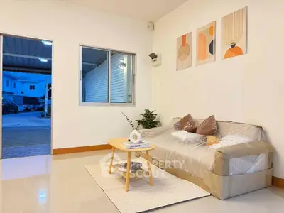 Modern living room with stylish decor and cozy sofa in a bright, inviting space.