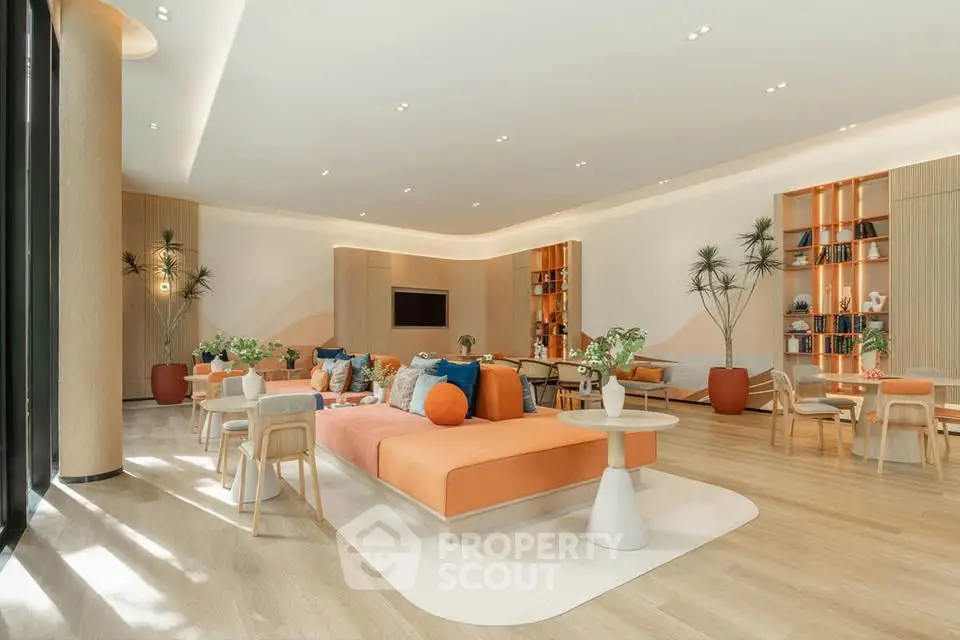Spacious modern living room with stylish decor and ample natural light