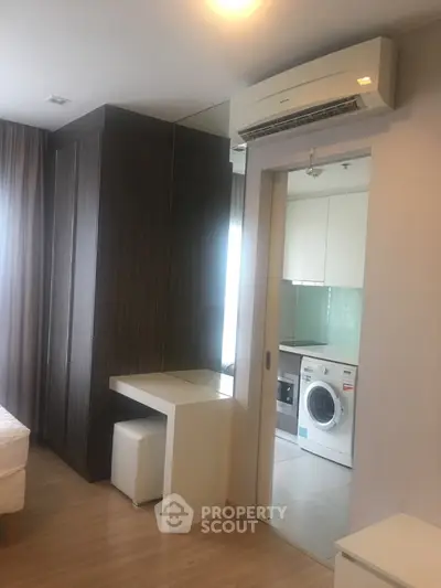 Modern apartment interior with washing machine and air conditioning