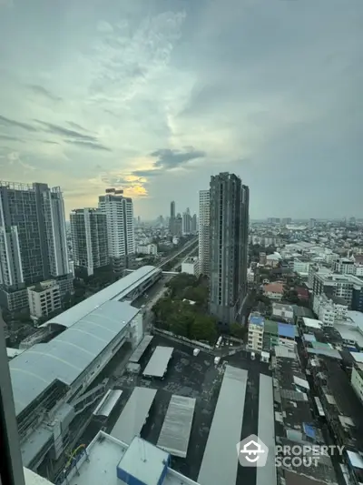 Stunning cityscape view from high-rise building with expansive skyline and urban landscape.